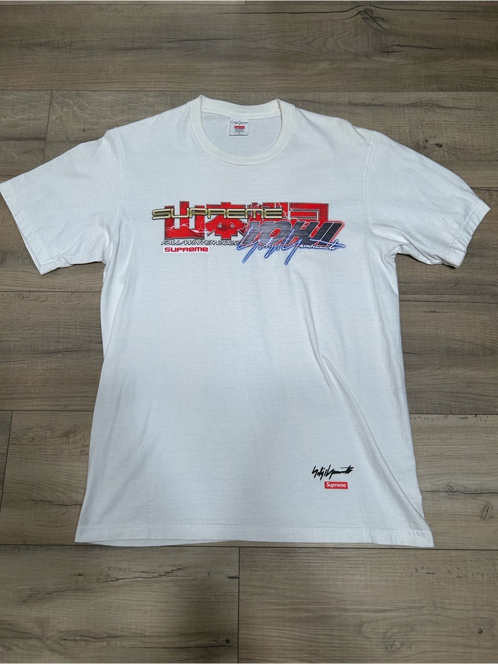 Supreme White Crewneck with Red, Blue and Gold Graphic